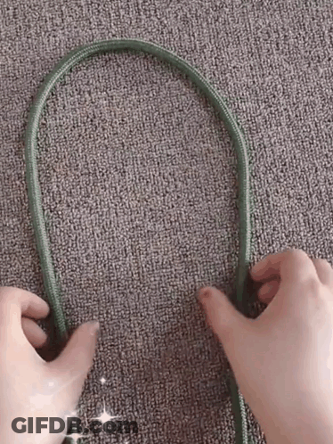 Person Holding Green Cord GIF