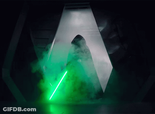 Person Holding Green Lightsaber GIF