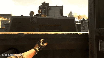 Person Holding Gun At PTV Building GIF