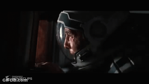 Person Holding Gun In Dark Room GIF