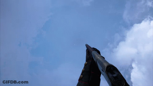 Person Holding Gun In Front Of Blue Sky GIF
