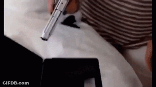 Person Holding Gun On Tablet GIF