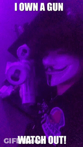 Person Holding Gun Saying I Own A Gun Watch Out GIF