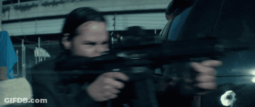 Person Holding Gun With Bullet Hole In Back GIF