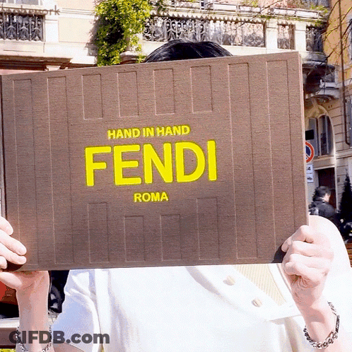 Person Holding Hand In Hand Fendi Roma Sign GIF