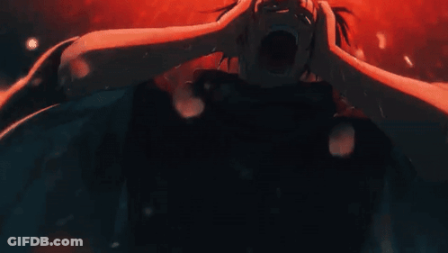 Person Holding Head In Dark Room GIF