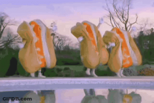 Person Holding Hot Dog In Front Of Grill Saying What Are You Putting On Your Wiener GIF