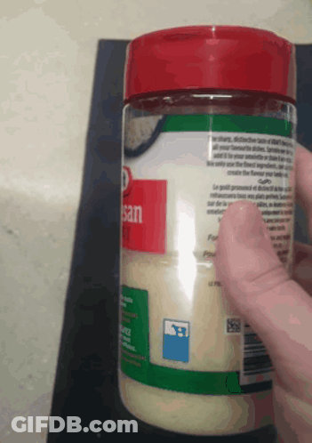 Person Holding Jar Of Sesame Seeds GIF