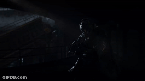 Person Holding Kastov782 Voltspire Rifle In Dark Room GIF