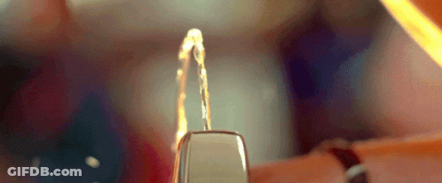 Person Holding Lighter With Water Coming Out GIF