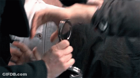 Person Holding Magnifying Glass GIF