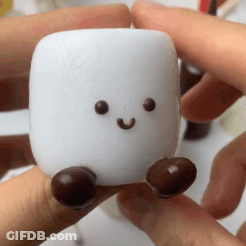 Person Holding Marshmallow With Face And Feet GIF