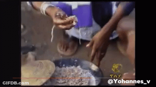 Person Holding Meat In Front Of Pan GIF