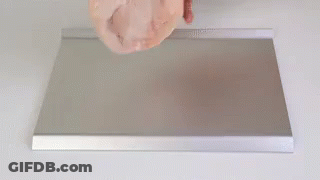 Person Holding Meat On Metal Tray GIF