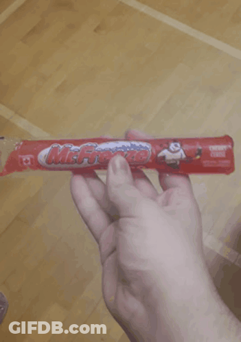 Person Holding Mr. Freeze Cereal Bar GIF