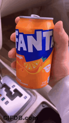 Person Holding Orange Fanta Can GIF
