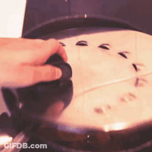 Person Holding Pan Lid On Stove GIF