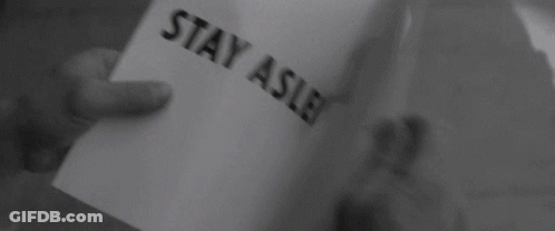 Person Holding Paper Saying Buy Do Not Question Authority GIF
