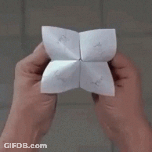 Person Holding Paper Saying Origami GIF
