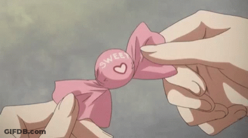 Person Holding Paper With Cartoon Character GIF