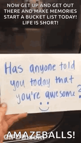 Person Holding Paper With Smiley Face GIF