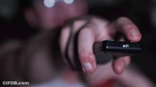 Person Holding Pause Button Remote GIF