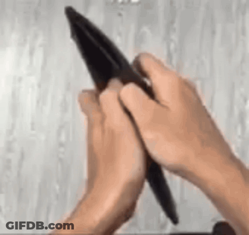 Person Holding Pen And Wallet GIF