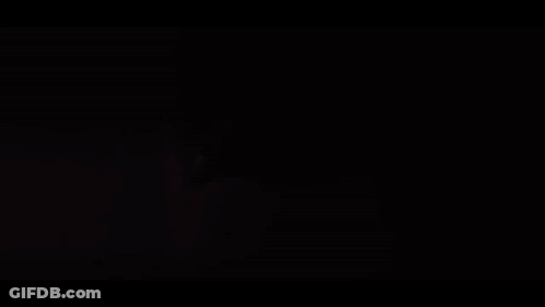 Person Holding Pen In Mouth With Bright Light GIF