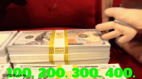 Person Holding Pen Over $100,000 GIF