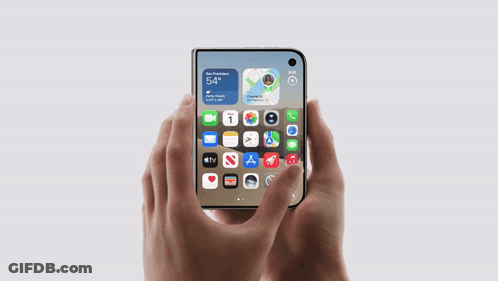 Person Holding Phone Showing 5:54 GIF