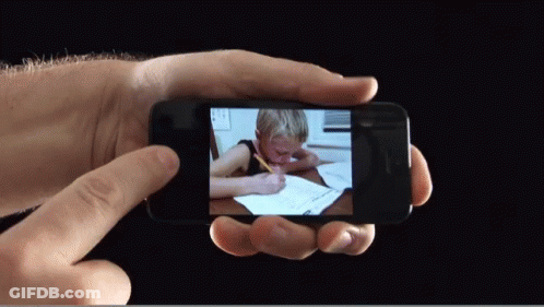 Person Holding Phone With Child Writing GIF