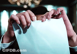 Person Holding Piece Of Paper With Fingers GIF