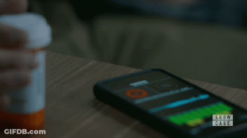 Person Holding Pills In Front Of Show Case Logo GIF