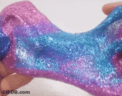 Person Holding Pink And Blue Slime With Glitter GIF