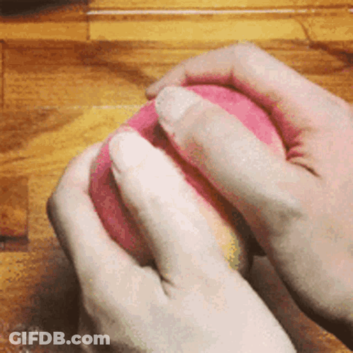 Person Holding Pink Ball GIF