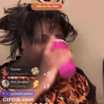 Person Holding Pink Object By Join My Fan Club Sign GIF