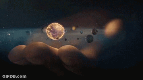 Person Holding Planet Surrounded By Planets GIF