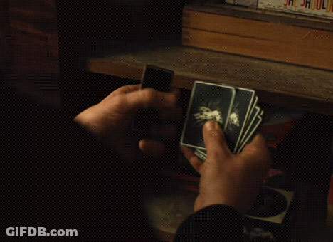 Person Holding Playing Cards GIF