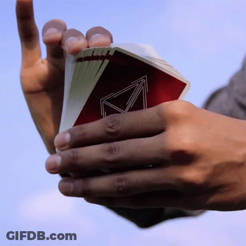 Person Holding Playing Cards With Triangle Back GIF