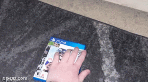 Person Holding PS4 Video Game GIF