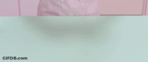 Person Holding Purple Chain Over Dough GIF