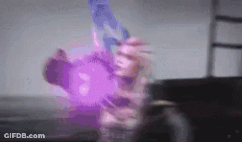 Person Holding Purple Object GIF