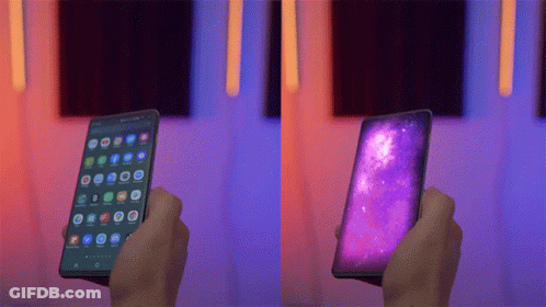 Person Holding Purple Screen Cellphone GIF
