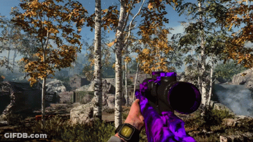 Person Holding Purple Sniper Rifle In Forest GIF