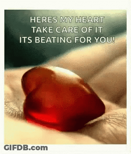 Person Holding Red Heart Saying Heres My Heart GIF
