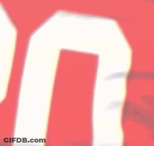 Person Holding Red Item With Number 7 GIF