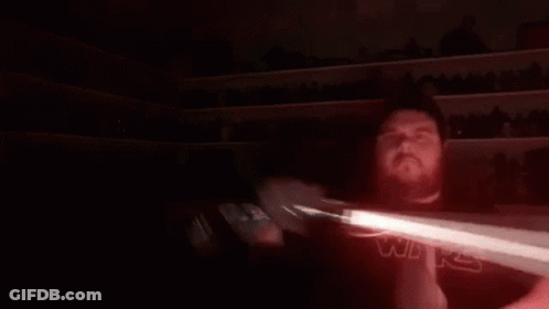 Person Holding Red Laser Beam GIF