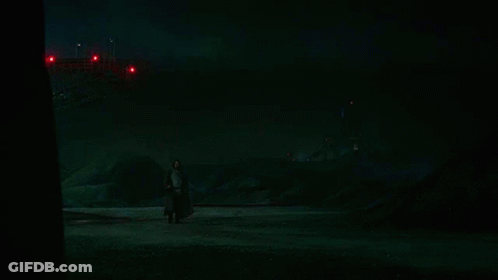 Person Holding Red Lightsaber GIF