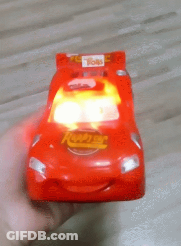 Person Holding Red Toy Car Saying Lightning McQueen GIF