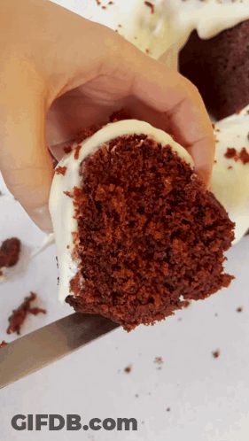 Person Holding Red Velvet Cake Slice GIF